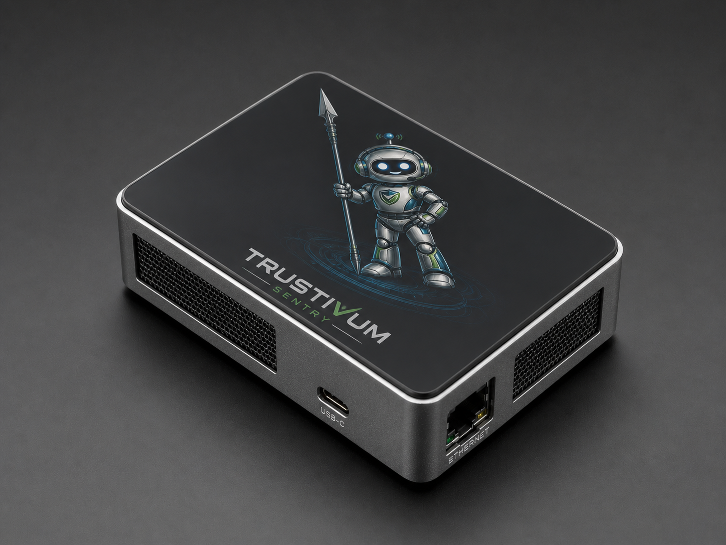 Trustivum Sentry — slim aluminum-cased Raspberry Pi appliance with the Trustivum mascot etched on top.